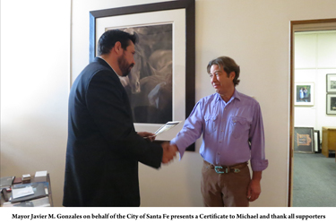 The Santa Fe Mayor presents a Certificate to Michael Smith